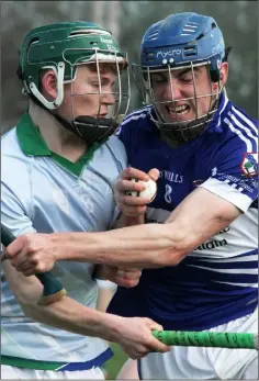  ??  ?? Dylan Lyne of Glynn-Barntown and Tom White (Oylegate-Glenbrien) in a determined battle for the ball.