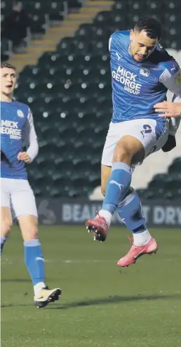  ??  ?? Jonson Clarke-Harris challenges for a header at Plymouth.