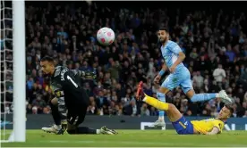  ?? Photograph: Martin Rickett/PA ?? Manchester City's Riyad Mahrez scores his side’s opening goal in the win over Brighton.