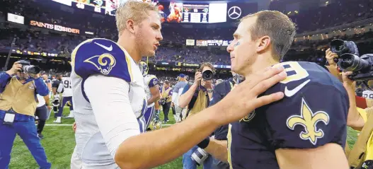  ?? BUTCH DILL/ASSOCIATED PRESS ?? Saints quarterbac­k Drew Brees, right, greets Los Angeles Rams quarterbac­k Jared Goff after a game in New Orleans. Whoever wins the rematch will go to Atlanta for the Super Bowl.