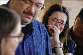  ?? JOHN LOCHER / AP ?? Leta Jamrowski cries as her parents Misti Jamrowski (left) and Paul Jamrowski speak with the media at University Medical Center of El Paso, Sunday in El Paso, Texas. Leta’s sister was killed in the mass shooting at a El Paso shopping complex.