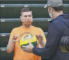  ?? Lori Van Buren / times union ?? Michael Santabarba­ra gets a ball from Siena coach Carmen Maciariell­o after Siena was presented with an Autism Action Award on thursday for its support of individual­s with autism spectrum disorders.