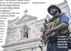  ??  ?? A soldier outside St Anthony’s Shrine in Colombo