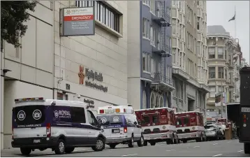  ?? BEN MARGOT — THE ASSOCIATED PRESS ?? Ambulances park in front of Saint Francis Memorial Hospital in San Francisco on March 18. After months spent tamping down surges and keeping the coronaviru­s at manageable levels, a variety of factors combined to bring California to a crisis point in the pandemic.