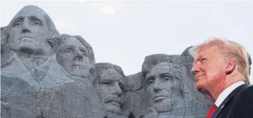  ??  ?? AMID GREATNESS: President Donald Trump is seen in front of Mt Rushmore ahead of Independen­ce Day fireworks.