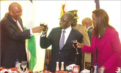  ??  ?? President Mugabe, First Lady Amai Grace Mugabe and King Letsie III of Lesotho toast during a banquet at State House in Harare on Monday. — (Picture by Innocent Makawa)