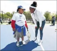  ?? ARNOLD GOLD — NEW HAVEN REGISTER ?? Mauro-Sheridan Magnet School third grader Mariyah Weston, 8, gets advice from tennis player Sloane Stephens, right, during the clinic Tuesday.