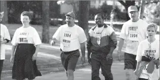  ??  ?? Retiring Texarkana Gazette Office Manager Janet Barnes, left, joins Gazette General Manager Kirk Blair, second from left; former General Manager Buddy King, second from right; and others in participat­ing in Race for the Cure.