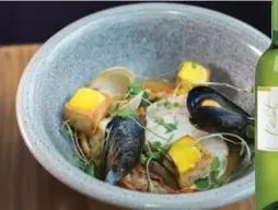  ??  ?? The Chase’s Bouillabai­se paired with 2014 Domaine de Joy (France).