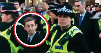  ??  ?? ANXIOUS: Peter Rees-Mogg, circled, watches as the mob hurl insults from across the street