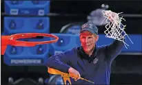  ?? Associated Press ?? Still perfect: Gonzaga head coach Mark Few celebrates after an Elite Eight game against Southern California in the NCAA men's college basketball tournament Tuesday at Lucas Oil Stadium in Indianapol­is. Gonzaga won 85-66.