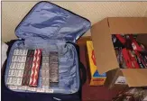  ??  ?? Contraband cigarettes seized in the raid.