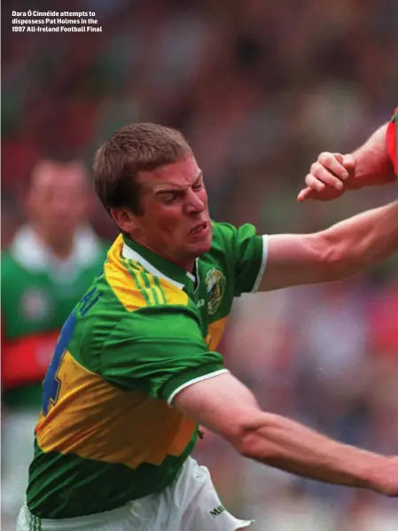  ??  ?? Dara Ó Cinnéide attempts to dispossess Pat Holmes in the 1997 All-Ireland Football Final