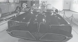  ?? National Museum of Funeral History ?? The Museum of Funeral History’s Batmobile replica features the crime-fighting gizmos of the original. In its 30,500 square feet, the museum also houses replica presidenti­al caskets, among other curiositie­s.