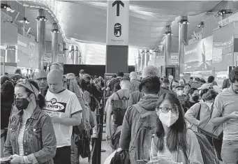  ?? Frank Augstein/Associated Press ?? Staffing concerns have led to long lines, flight cancellati­ons and lost baggage that have frustrated passengers at Heathrow Airport in London. In response, the airport is institutin­g a capacity cap.