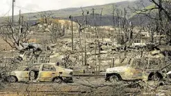  ?? ?? POSTAPOCAL­YPTIC Carcasses of cars can be seen among the ashes of burnt neighborho­od in the aftermath of a wildfire, is seen in Lahaina, western Maui, Hawaii on Aug. 14.