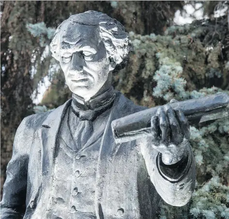  ?? MICHAEL BELL ?? Some have called for the John A. Macdonald statue at Victoria Park to be removed. The statue has been in the park for decades.