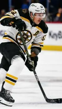  ?? DUSTIN BRADFORD/GETTY IMAGES ?? Brad Marchand skates into the offensive zone during a scoreless first period in Denver but the Bruins picked up their pace and scored twice in the second period.