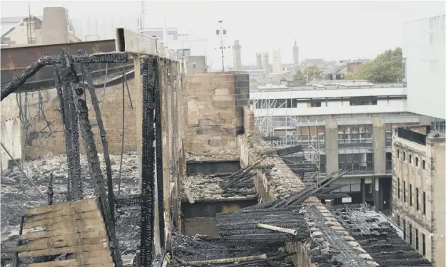  ??  ?? Drone footage showing the extent of the damage to the building, above and far left, was taken during a site visit by GSA staff and outside experts. Left, GSA board chairwoman Muriel Gray was among those on the site visit. She said she was ‘optimistic’...