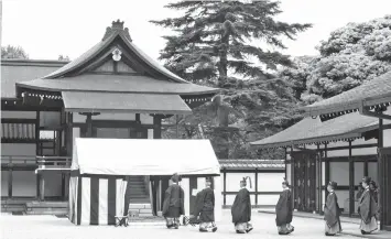  ?? — AFP photo ?? This handout photo taken and released by Japan’s Imperial Household Agency shows an imperial turtle-shell divination rite held at the Imperial Palace in Tokyo.