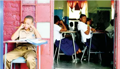  ?? RICARDO MAKYN/CHIEF PHOTO EDITOR ?? Eleven-year-old Errol Simpson Jr contemplat­es his answer while sitting yesterday’s ability component of the Primary Exit Profile (PEP) examinatio­n at the St Aloysius Primary School in Kingston. Errol, who contracted dengue last week and spent Sunday at the Bustamante Hospital for Children, was determined to sit the examinatio­n. The school accommodat­ed him by allowing him to sit on the outside so he could get some fresh air, providing him with liquids and painkiller­s, and giving him extra time to rest.