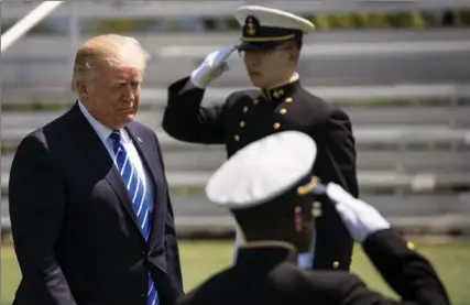  ?? DREW ANGERER, GETTY IMAGES ?? Donald Trump told graduates at the commenceme­nt ceremony at the U.S. Coast Guard Academy that no president has been treated worse than he has.