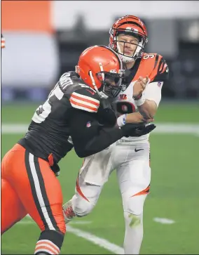  ?? TIM PHILLIS — FOR THE NEWS-HERALD ?? Myles Garrett pressures Joe Burrow during the Browns-Bengals game Sept. 17at FirstEnerg­y Stadium.