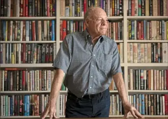  ?? Steve Mellon/ Post- Gazette ?? Marshall Cohen in the library of his Shadyside home. Over the years, Mr. Cohen has collected thousands of books. He’s working to establish a book festival in Pittsburgh — an idea endorsed by members of Pittsburgh City Council.