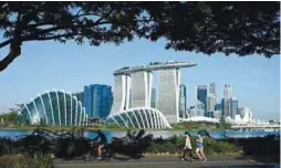  ??  ?? Singapore’s economy is charting an uneven recovery after posting its worst ever recession last year due to the Covid-19 pandemic. – AFPPIX