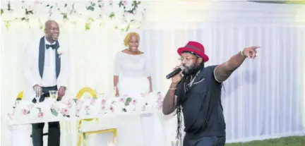  ??  ?? The bride’s favourite artiste, Tarrus Riley, gives a riveting performanc­e at the reception.