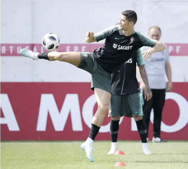  ?? — GETTY IMAGES ?? Portugal forward Cristiano Ronaldo will lead his side against Uruguay and its talented striker, Luis Suarez, in the Round of 16 Saturday at the Russia 2018 World Cup, a tournament that provided plenty of fireworks in the group stage and promises many...