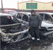  ??  ?? Mechanic Joe Dunlop at his garage yesterday after a second arson attack in Carrickfer­gus believed to be linked to the UDA