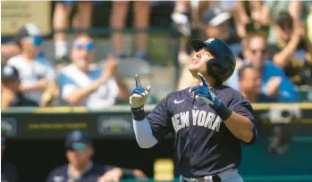  ?? GERALD HERBERT/AP ?? The Yankees Anthony Volpe reacts after hitting a leadoff solo home run in the first inning of a spring training game against the Pirates on Thursday in Bradenton, Florida.