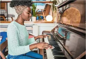  ?? — AFP ?? Playing a musical instrument, particular­ly the piano, can improve memory and the ability to solve complex tasks.