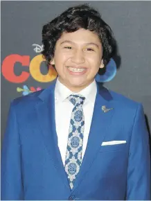  ?? ADRIANA M. BARRAZA/WENN.COM ?? Anthony Gonzalez and his character in the film Coco both share a love of music.