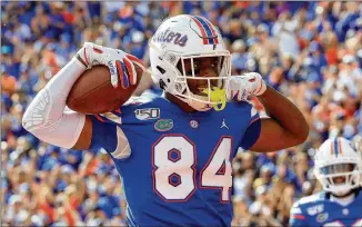  ?? SAM GREENWOOD/GETTY IMAGES/TNS ?? Florida tight end Kyle Pitts finished his college career with 100 receptions for 1,492 yards and 18 TDs and is a top draft prospect for the Falcons.