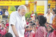  ?? HT ?? PM Narendra Modi interacts with students at a government­run primary school in Varanasi, on his birthday on Monday