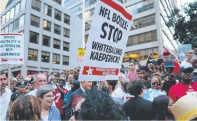  ?? Craig Ruttle, The Associated Press ?? People gather in support of Colin Kaepernick on Wednesday in New York.