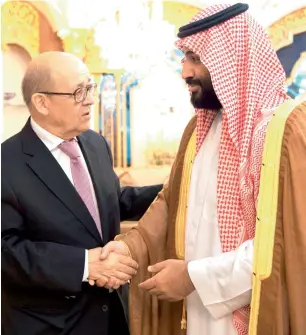  ?? AP ?? Saudi Crown Prince Mohammed bin Salman receives visiting French Foreign Minister Jean-Yves Le Drian in Jeddah. —