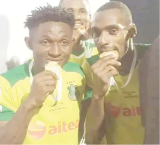  ??  ?? Kano Pillars star strikers, Nyima Nwagua (R) and David Ebuka celebrate after their team won the 2019 Aiteo Cup