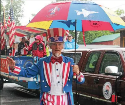  ?? PHOTOS BY LAUREN HALLIGAN — LHALLIGAN@DIGITALFIR­STMEDIA.COM ?? Uncle Sam marching in the Veterans of Lansingbur­gh 21st annual Memorial Day Parade.