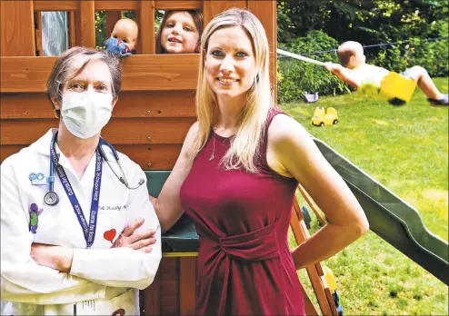  ?? Peter Hvizdak / Hearst Connecticu­t Media ?? Alissa Hill, of Bethany, right, with her daughter, Mackenzie Hill, center, and her mother, Elisabeth Reilly, a pediatric nurse practition­er at Clinton Avenue School in New Haven, in the backyard of Hill’s home. On the swing in the background is Hill’s son, Bradford, 3.