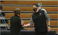  ??  ?? Stanford coach Tara VanDerveer is presented with the game ball from Pacific coach Bradley Davis, a former Chico High teacher and coach. With the win, VanDerveer became the winningest coach in women’s basketball history.