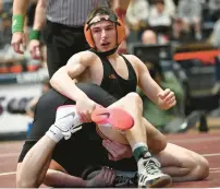  ?? AMY SHORTELL/THE MORNING CALL ?? Northampto­n’s Trey Wagner, top, wrestles Easton’s Chris Kelly in the 127-pound final at the District 11 Class 3A championsh­ips on Saturday at Liberty High School in Bethlehem.