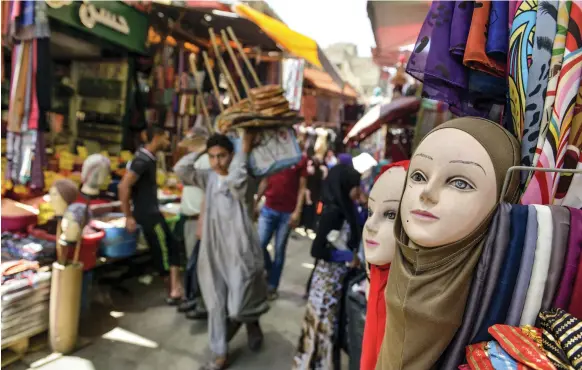  ?? AFP ?? Market offerings in Cairo. While consumer prices have risen, some economists say that inflation has now peaked and will ease by the turn of the year