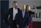  ?? JAE C. HONG — THE ASSOCIATED PRESS FILE ?? President Joe Biden, center, smiles to the crowd as he is flanked by California Gov. Gavin Newsom and Jennifer Siebel Newsom at a rally ahead of the California gubernator­ial recall election in Long Beach.