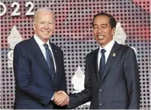  ?? ?? Working together: Joko and Biden shaking hands during the G20 Summit in Nusa Dua, Bali, Indonesia. — AP