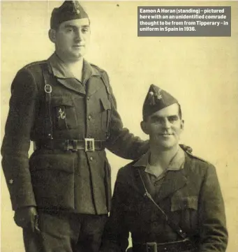  ??  ?? Eamon A Horan (standing) – pictured here with an an unidentifi­ed comrade thought to be from from Tipperary – in uniform in Spain in 1936.