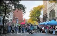  ?? LAUREN HALLIGAN LHALLIGAN@DIGITALFIR­STMEDIA.COM ?? Monument Square is busy with people during the 2017 Troy ChowderFes­t on Sunday in downtown Troy.