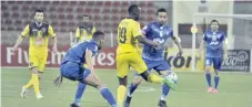  ?? — Saleh al Sharji ?? Iran’s Esteghlal and Saudi Arabia’s Al Taawoun players fight for the ball at the Sultan Qaboos Sports Complex.